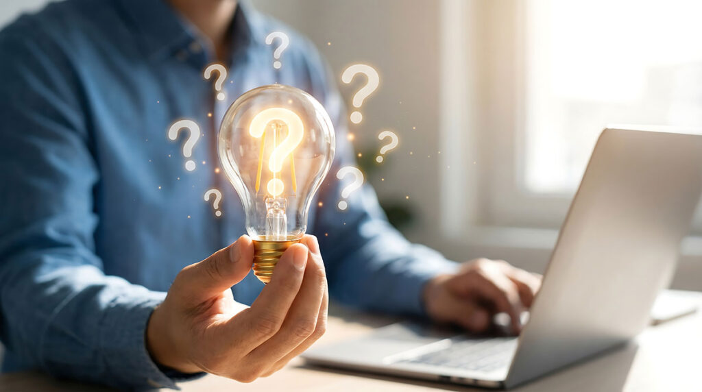 man holding lightbulb with questionmark
